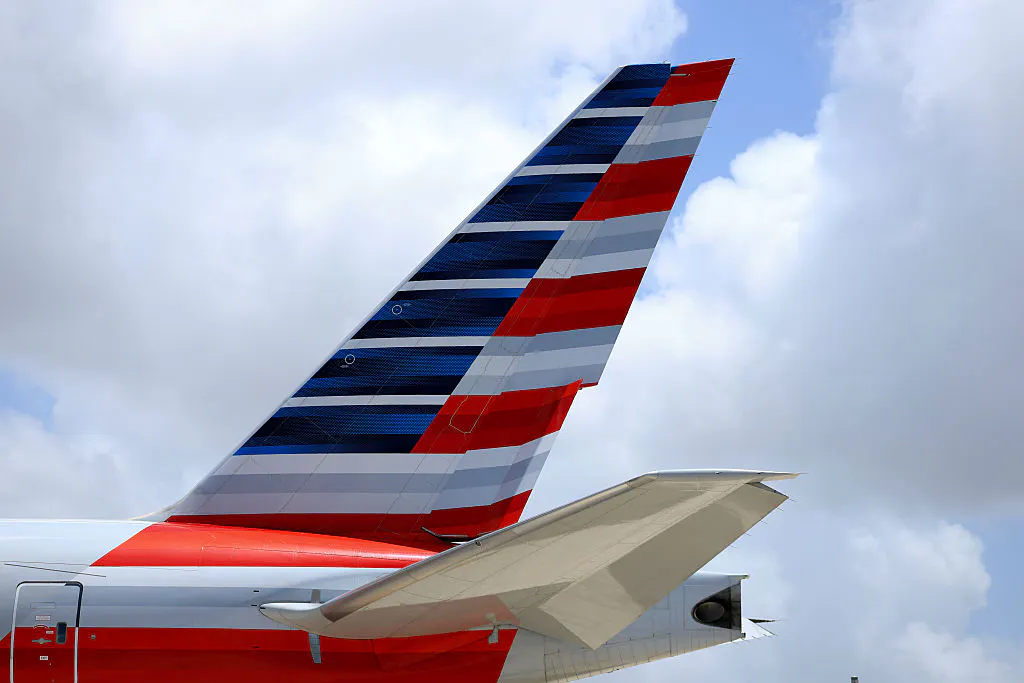 American Airlines cuts its full-year earnings forecast, reports better than expected Q1 revenue