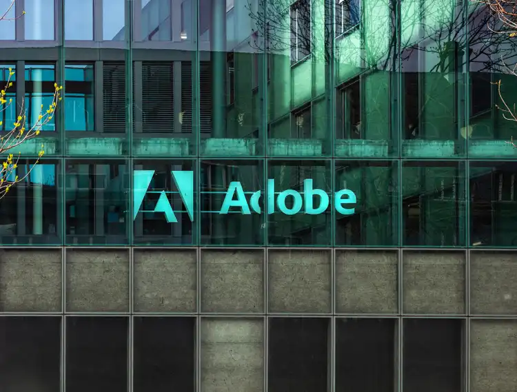 Adobe tumbles after outlook disappoints Wall Street, TD Cowen cuts rating