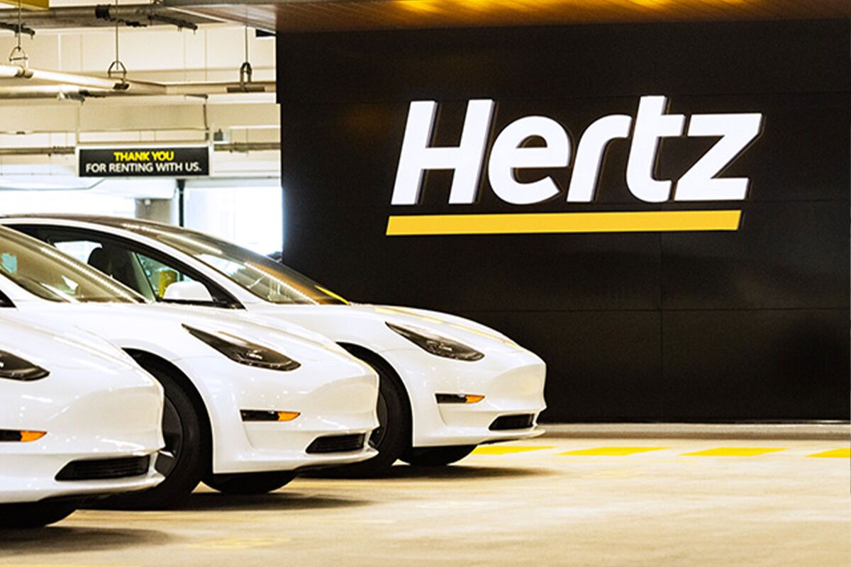 Hertz Posts Loss as It Reduces Tesla EV Fleet - Bloomberg