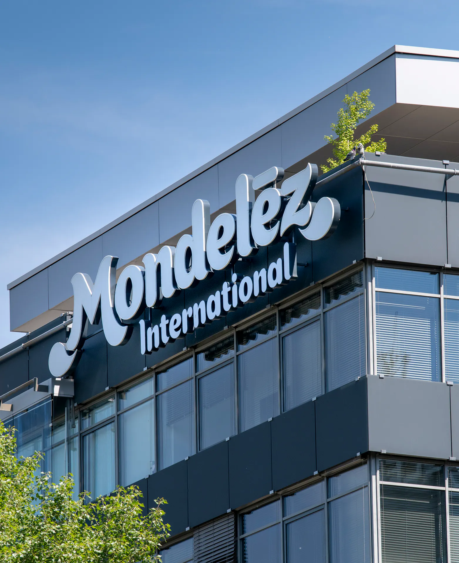 Mondelez drops after cutting full-year earnings forecast