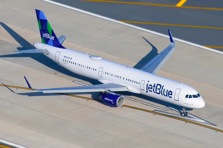 JetBlue Airways highlights its recent achievements and financial targets at an investor conference