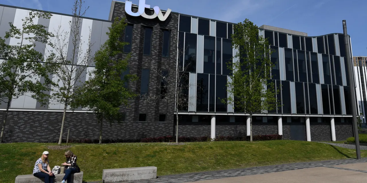 Just a week after spin-off plan, Comcast says it will buy British broadcaster
