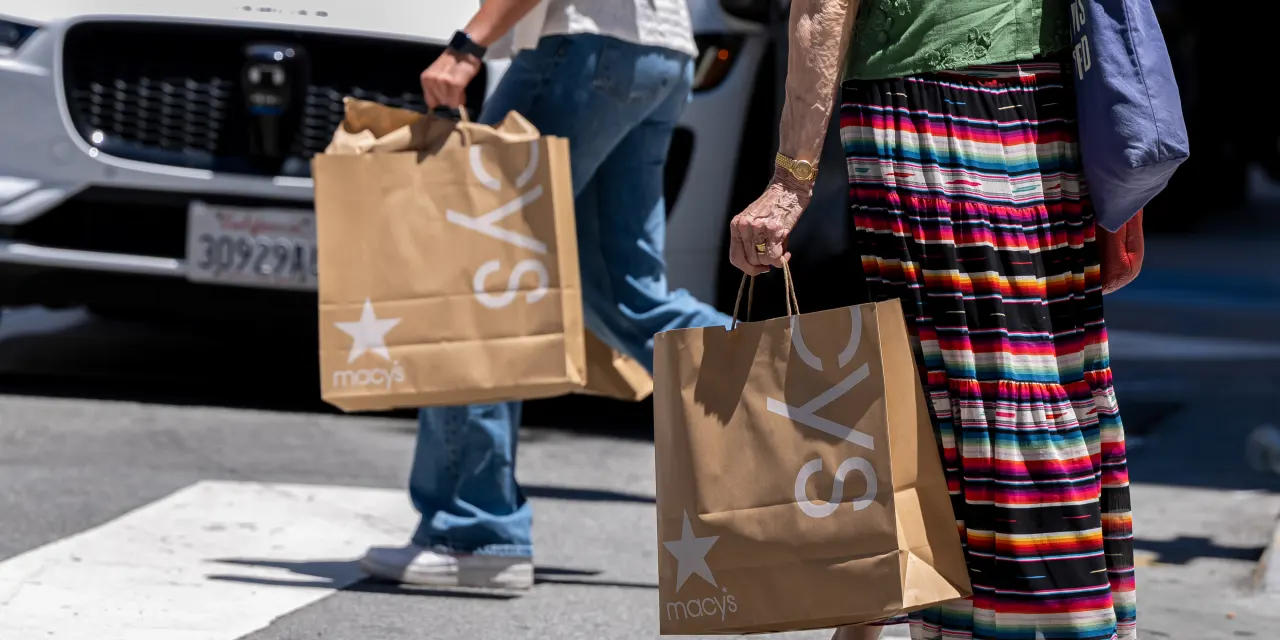 Why Consumers Are Still Spending: Less Debt, More Stocks