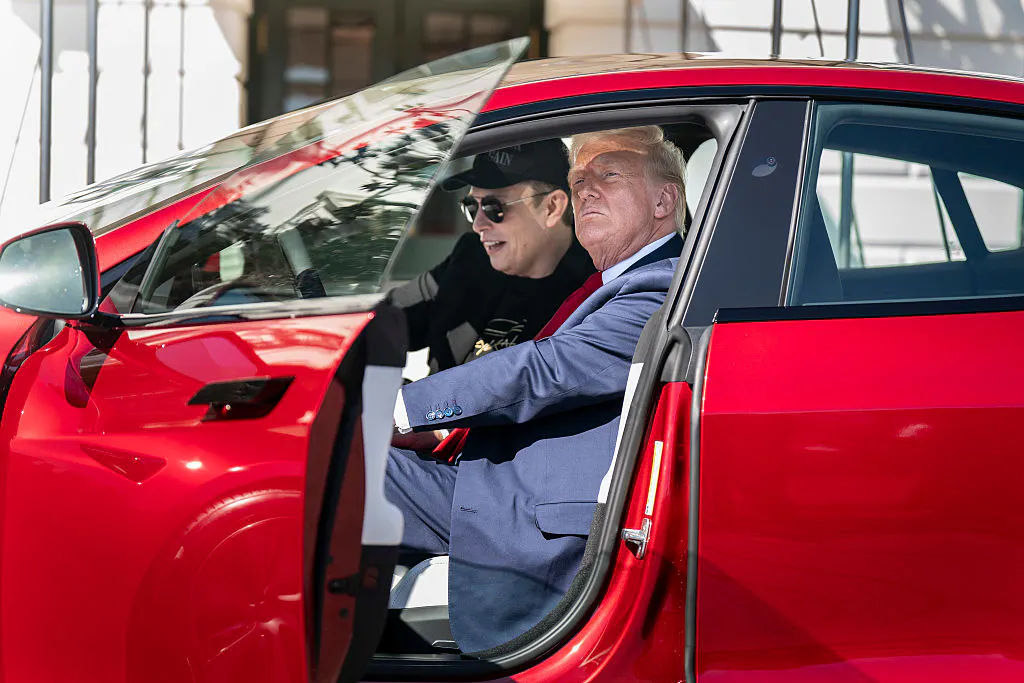 Tesla dips on two downgrades over Trump feud