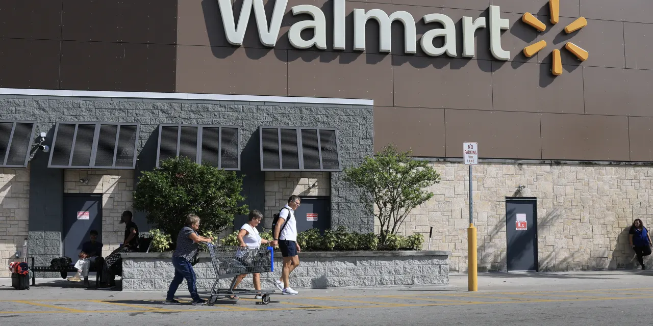 Walmart sees slowing sales growth and warns of a profit miss, in contrast to rival Target