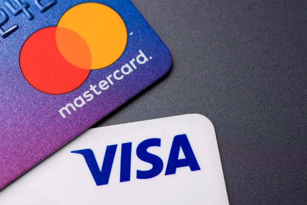 Visa, Mastercard Head Into Earnings With Spending Holding Firm
